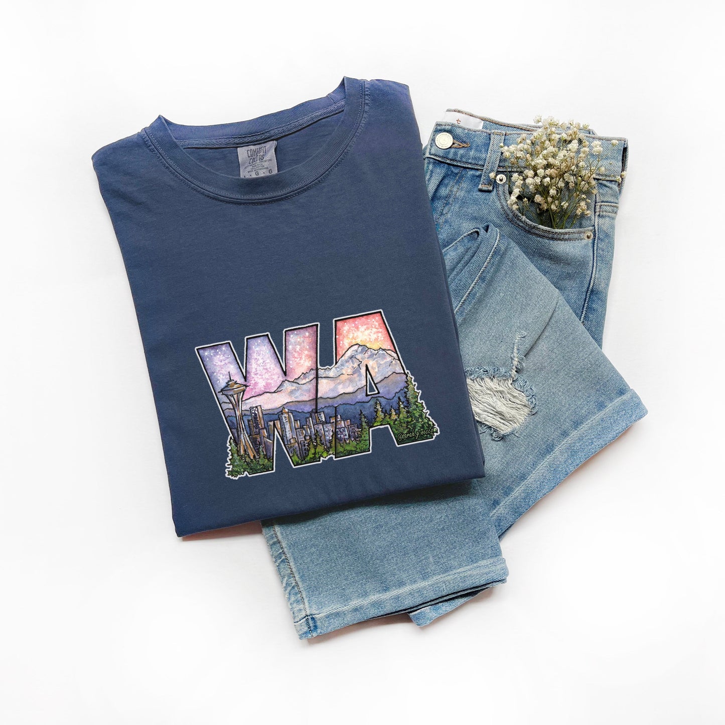 Navy blue t-shirt with 'WA' design on jeans and white background